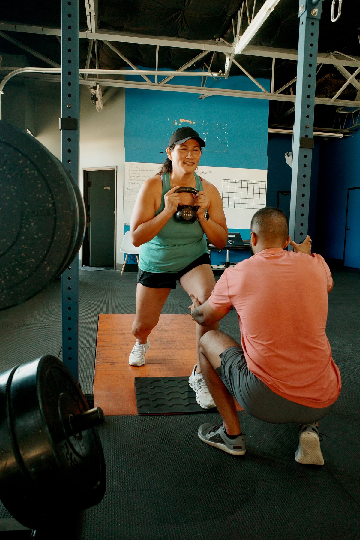 Dr. Nevin Saju coaching a patient through a loaded lunge